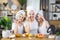 Mother with two daughters cleaning face with cotton pads