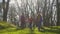 Mother with two daughters walking by the forest