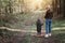 Mother walks with her child in the forest