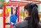 Mother watching play on the playground daughter