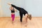 mother yoga instructor and daughter do balance and streching exercises