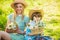 Motherhood happiness. Cowboy family collecting flowers in baskets. Lovely family nature background. Spring holiday