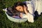 Motherhood. Woman sleep with infant child boy in basket outdoor