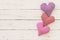 Mothers Day background with hearts border on white wood with copy space