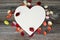 Mothers Day background. Wooden heart with copy space and dahlia flower petals