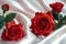 Mothers Day beauty red roses on satin for a heartfelt gift