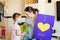 Mothers day, girl giving flowers and card to her mum