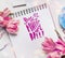 Mothers Day Greeting card with text lettering in german Beste Mutter der Welt , pale pink tulips, notebook or sketchbook