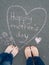 Mothers day - heart shape chalk drawing and the feet of a child