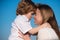 Mothers love. Closeup portrait of mother and child kissing. Mother hugging and embracing son. Mothers day, love family
