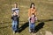 Mothers and sons on swing