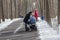 Mothers with strollers on a walk in the park in the winter