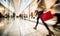 motion blur of people with shopping bags in a busy shopping mall. retail sale and discount