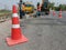 Motion blur, road construction with a red rubber cone in front