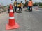 Motion blur, road construction with a red rubber cone in front