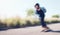 Motion blur, skateboard and mockup with a sports man skating outdoor on an asphalt street at speed. Balance, fast and