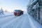 Motion blur of a truck on winter road on frosty sunny day