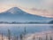 Motion blur from two duck floating on lake foreground and fuji