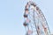 A motion blur view giant wheel or ferris wheel with the background of blue sky at india