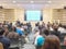 Motion blur of view of seminar with audience in a seminar room b