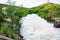 Motion blur of waterfall from overflow of dam on rainy season, N