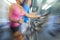 Motion Blur Zoom Man & Woman Using Gym Equipment