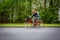 Motion blurred female biker on a city street