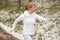 Motion blurred photo of woman running outdoors in winter