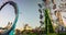 Motion blurred timelapse of carnival rides at dusk