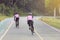 Motion blurry of Asian women Cycling during the race on road