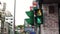 Motion of city traffic light turns on green for pedestrian walking