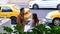 Motion of couple talking at sidewalk while taxi waiting for them