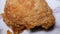 Motion of crispy kentucky fried chicken on plate