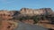 Motion On An Empty Rural Road To Red Mountain Rocks Buttes In Dry Desert Valley