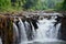 Motion and flowing water of Tad Pha Suam waterfall