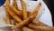 Motion of french fries on table inside Chinese restaurant