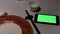 Motion of green screen phone and empty plate on table