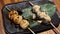 Motion of Japanese style grilled dango barbeque and sesame sauce on table