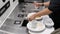 Motion of people cleaning leftover food at food court sorting station