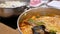 Motion of people eating hot pot boiling inside Chinese restaurant