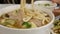 Motion of people eating pork with noodle soup