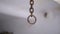 Motion of Rusty Iron Chain Suspended from the Ceiling in Torture Room. Close up