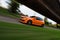 Motion shot of orange Volkswagen Golf GTi