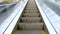 Motion up on contemporary escalator at city subway closeup