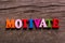 Motivate word made of wooden letters