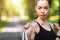 Motivated Asian Girl In Sportswear Posing With Jump Skipping Rope Outdoors