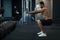 Motivated Athletic Black Man Exercising With Kettlebell At Modern Gym Interior