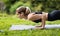 Motivated athletic woman standing in cobra pose