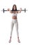 Motivated confident fitness woman holding barbell on her shoulder looking at camera.