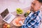 Motivated man trying to cook something really tasty